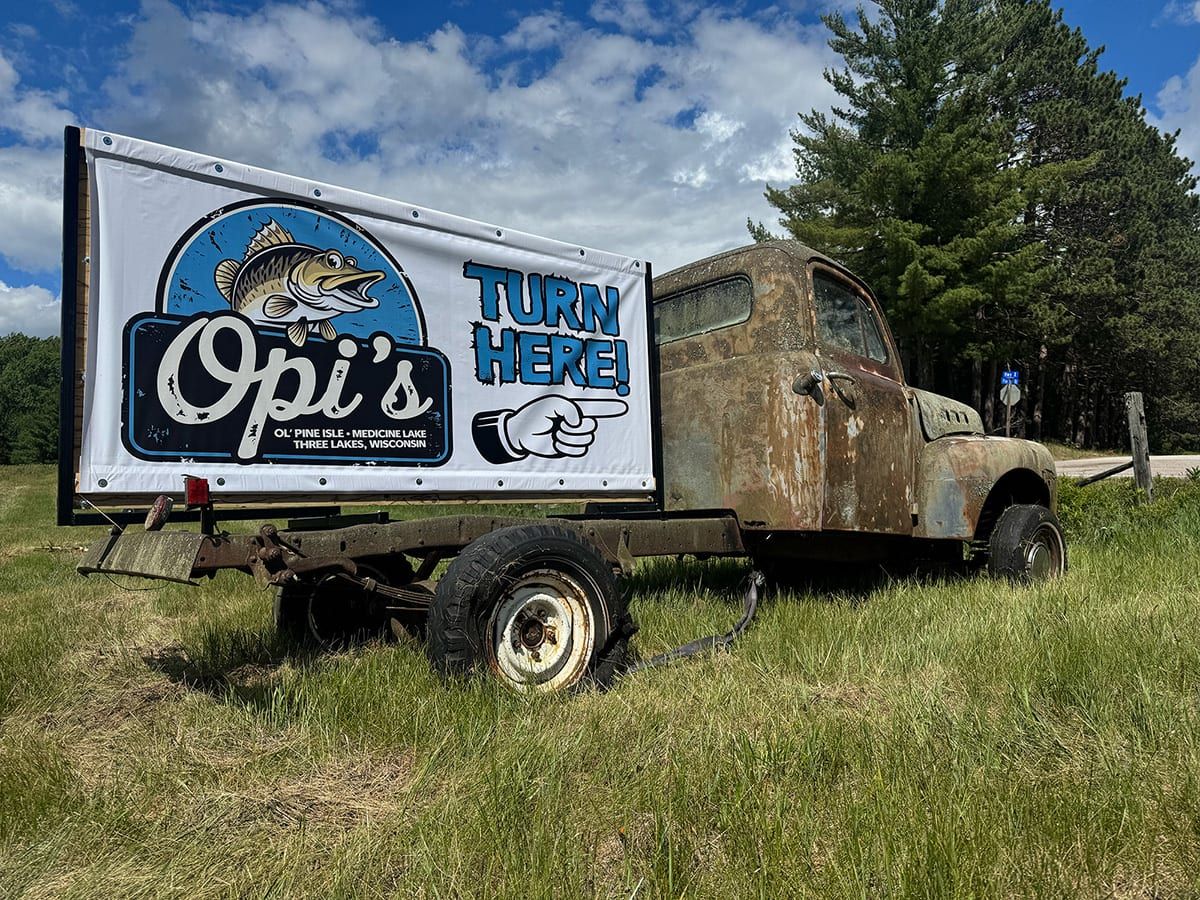 Vintage truck with Opi's turn-here sign